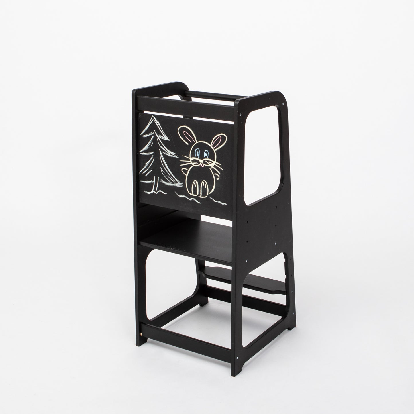 Black kitchen tower with blackboard panel featuring chalk drawings of forest animals and tree