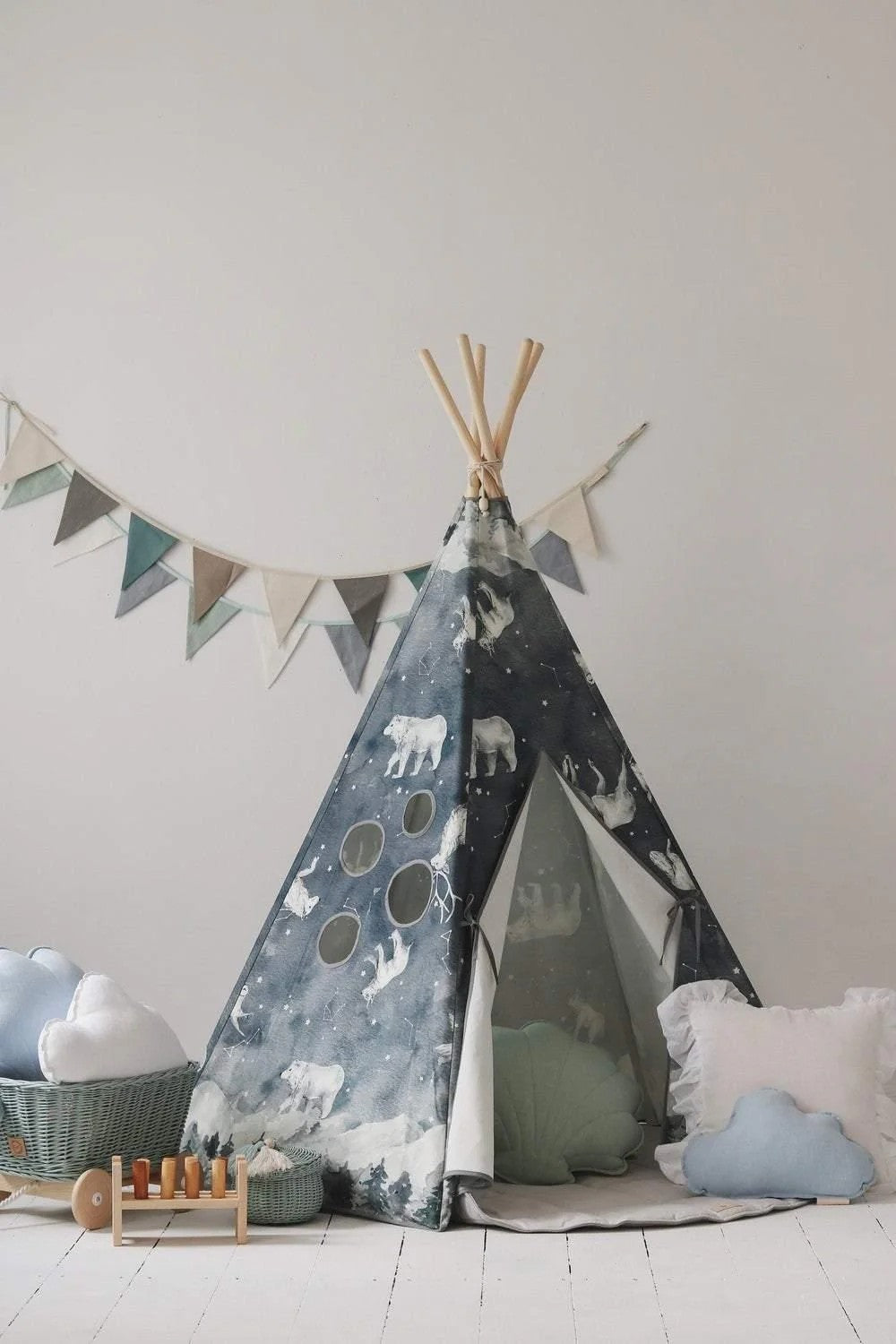 Night Sky teepee tent in styled room setting with storage basket, cloud decor, and wooden toys