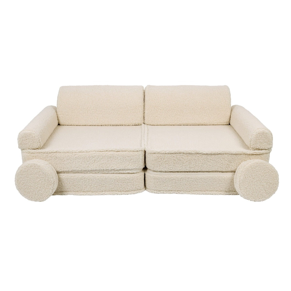 Complete bearly cream modular sofa assembled with backrests, armrests and round pillow supports