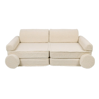 Complete bearly cream modular sofa assembled with backrests, armrests and round pillow supports