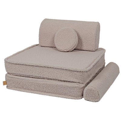 MeowBaby modular sofa stacked configuration showing layered foam pieces and bolster pillow