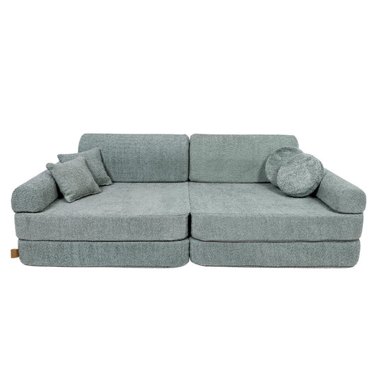 Fresh mint boucle modular sofa front view with cushions and round bolster pillows