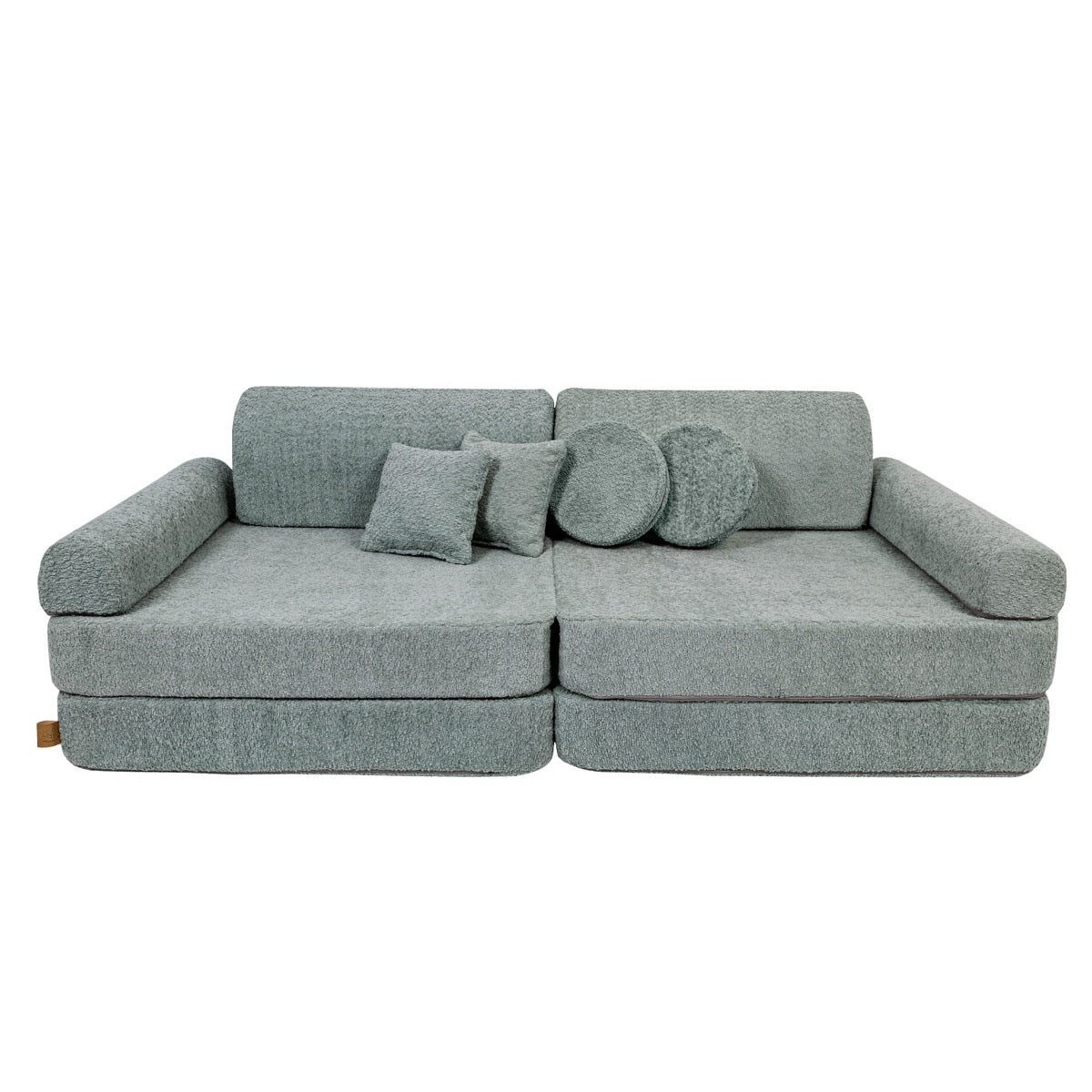 Fresh mint modular sofa with scatter cushions arranged on top