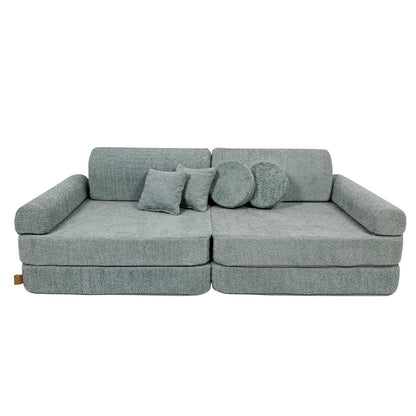 Fresh mint modular sofa with scatter cushions arranged on top