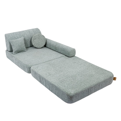 Modular sofa converted to lounger bed position with extended footrest