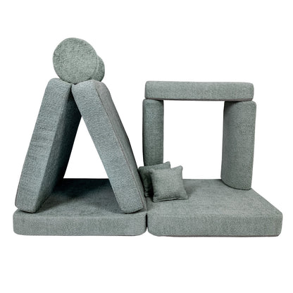 Soft boucle foam building blocks separated from sofa for floor play
