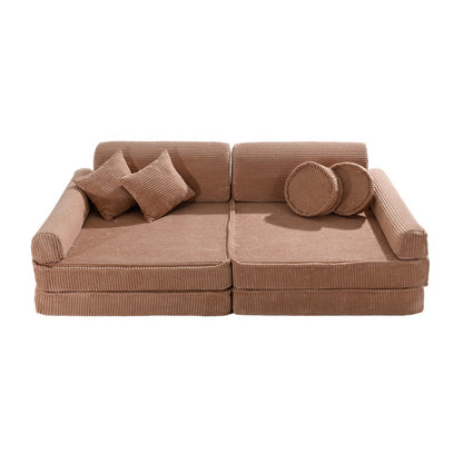 Powder pink corduroy modular sofa with two cushions, square pillows, and round armrests, top view