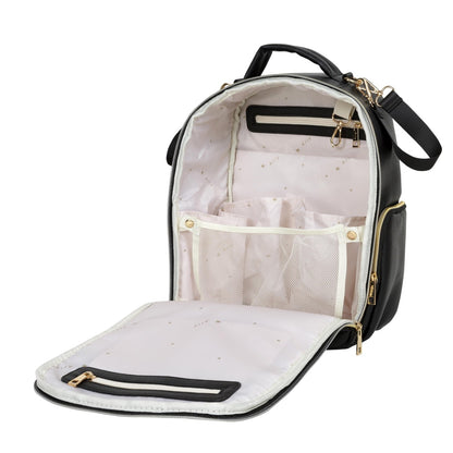 Interior layout of black diaper backpack with cream compartments