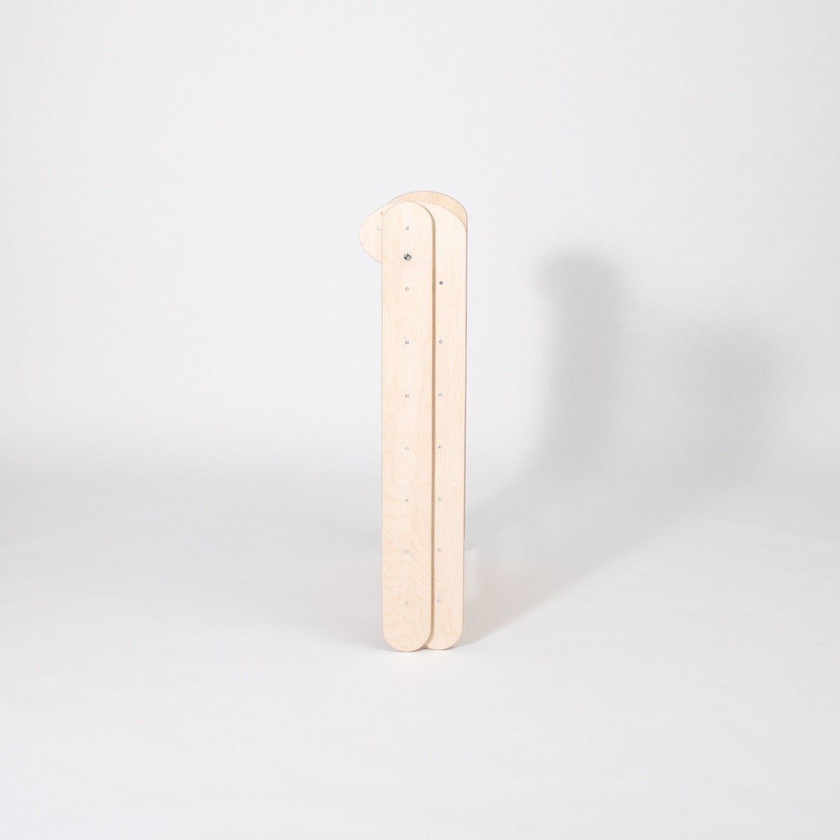 Single birch wood climbing ramp component with hole cutouts displayed vertically