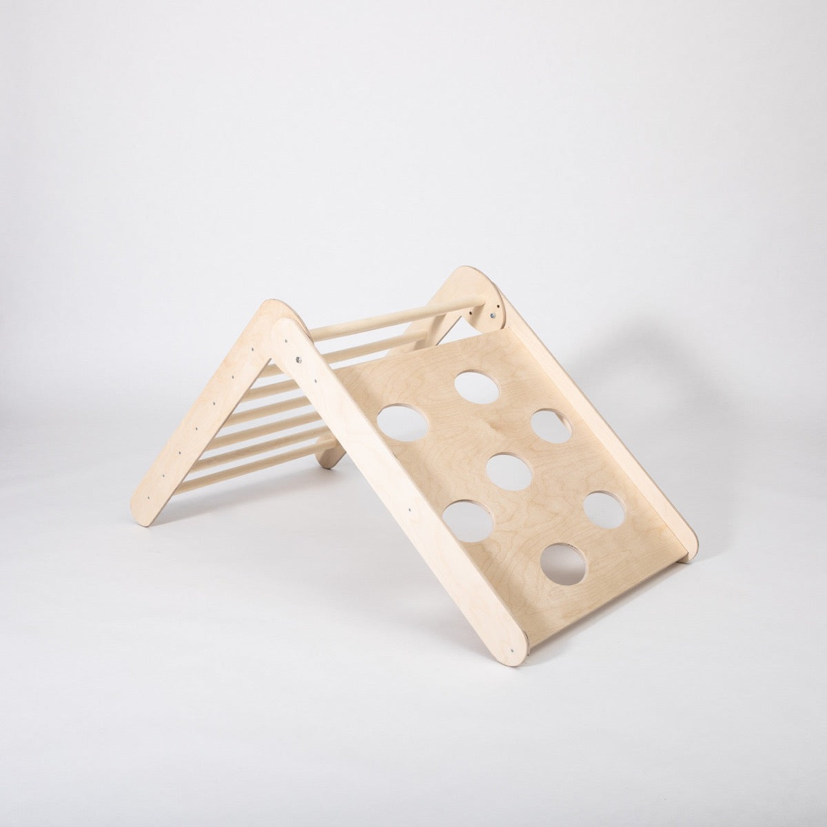 Wooden climbing triangle in steep slope position with hole details visible