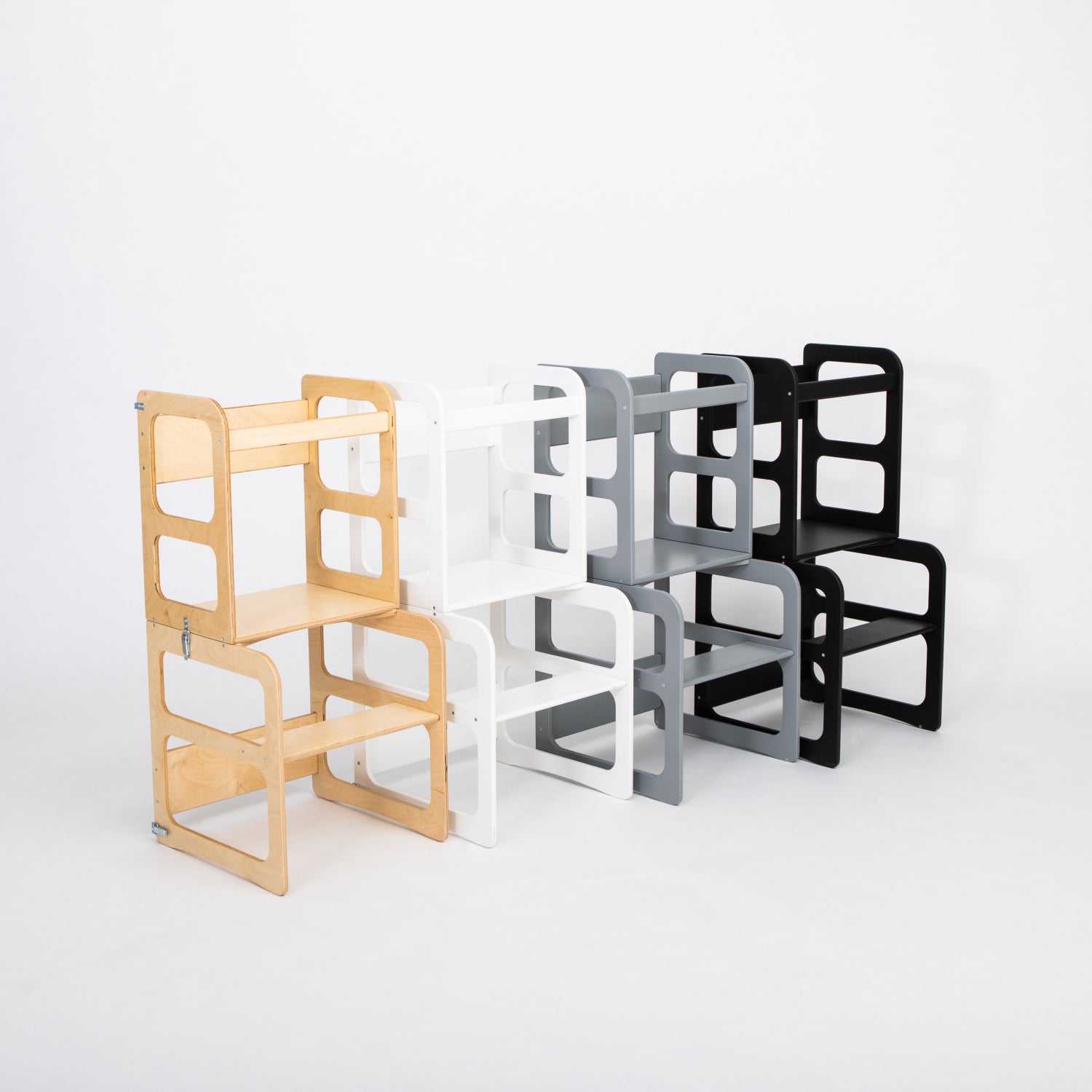 Lineup of natural wood, white, and black kitchen tower color variants
