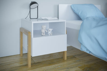 Victor nightstand in bedroom setting with toys stored on open shelf and blue bedding visible