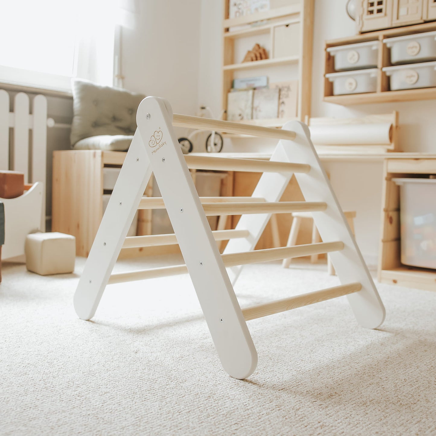 Montessori-inspired white climbing ladder in neutral playroom setting
