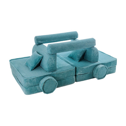 Turquoise corduroy modular sofa with wheels configured as playroom lounger with back support