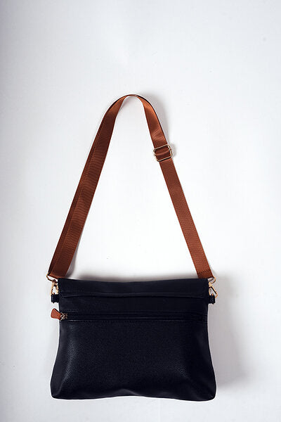Black coffee vegan leather baby handbag with cognac brown shoulder straps, front view