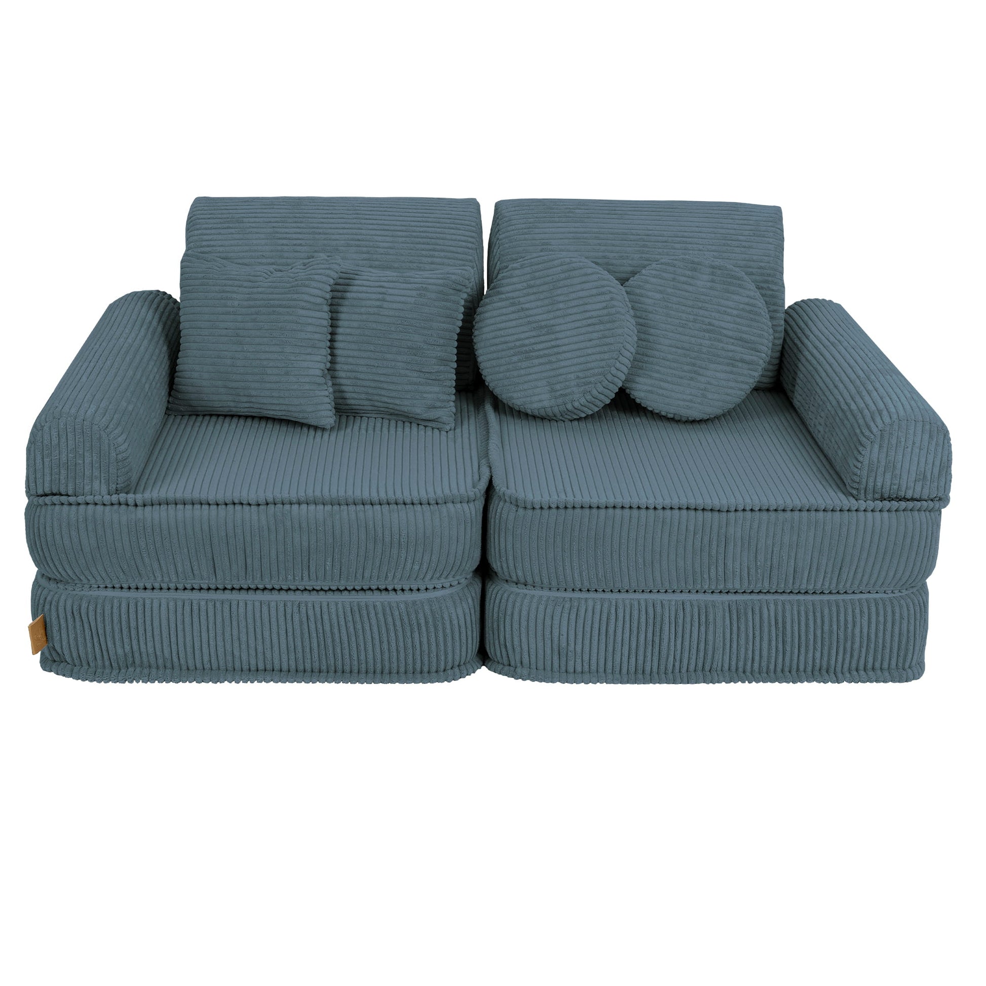 Medium turquoise modular sofa with square and round decorative pillows on two seats