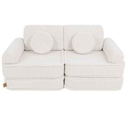 Bearly cream modular sofa front view with two round bolster pillows as backrest