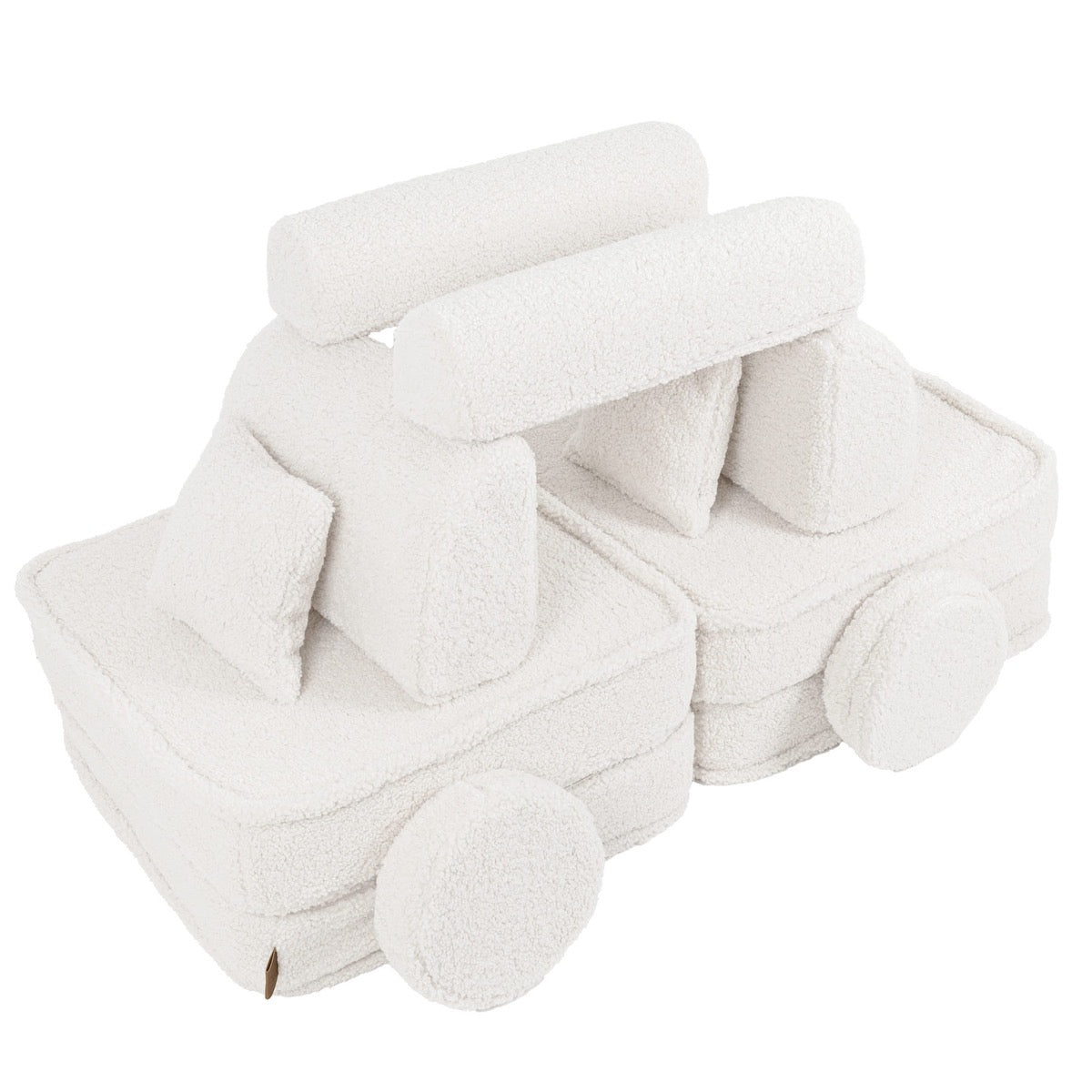 Bearly cream modular sofa rearranged into toy train shape with cushions and wheels