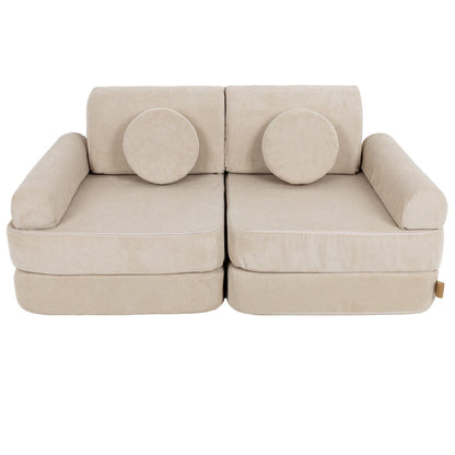 Medium modular sofa with round circle pillows on backrest and cylindrical side armrests