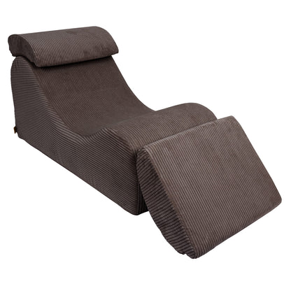 Brown Wave Lounger with extended footrest and neck support, three-quarter view
