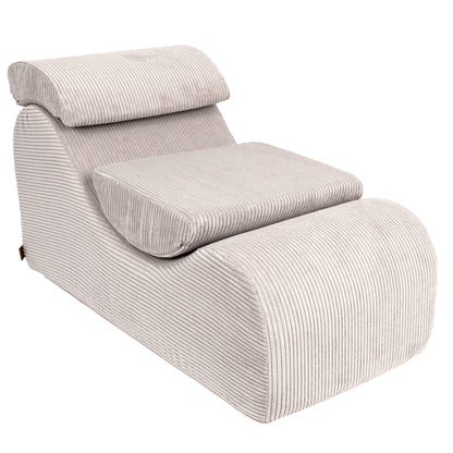 Wave Lounger ecru lounge chair angled view with ribbed upholstery and cushioned headrest