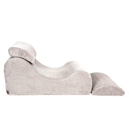 Wave Lounger ecru lounger side angle displaying leg support and ergonomic wave shape