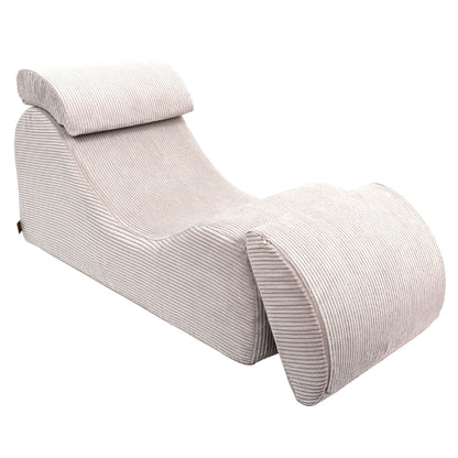 Wave Lounger ecru chaise lounge angled view with separate cushioned leg support