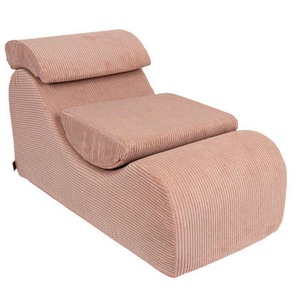 Wave Lounger in powder rose featuring cushioned seat, armrest, and relaxation setup
