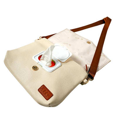 Mother and baby portrait with cappuccino lightweight handbag on shoulder