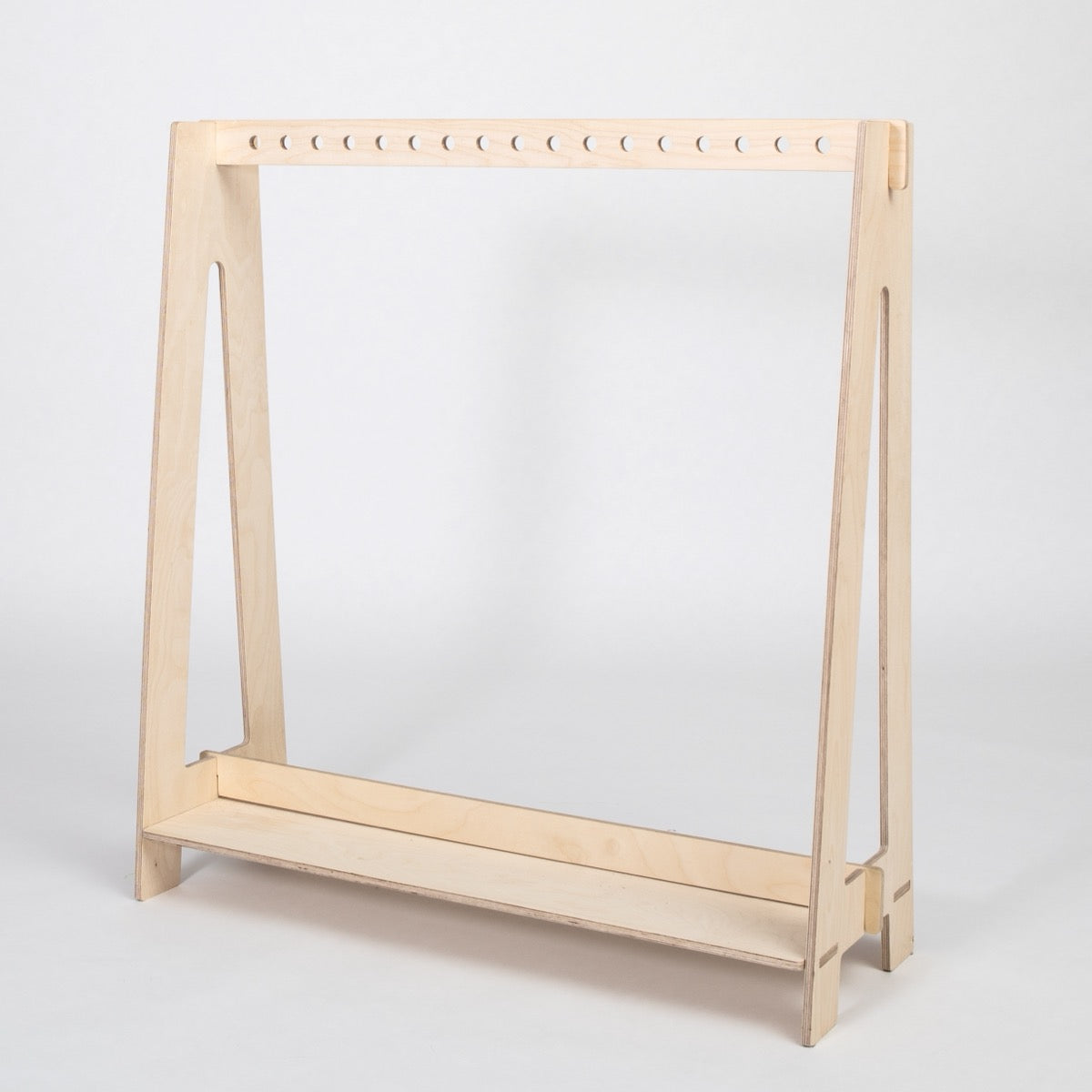 Natural wood finish Montessori dress-up rack with white perforated hanging rod
