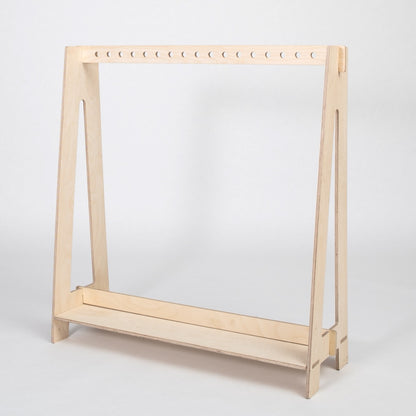 Natural wood finish Montessori dress-up rack with white perforated hanging rod