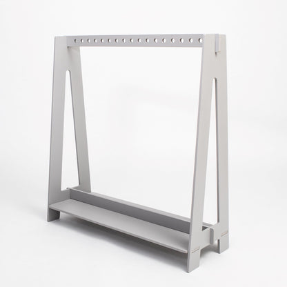 Grey birch plywood toddler clothing rack with hanging rod and storage shelf