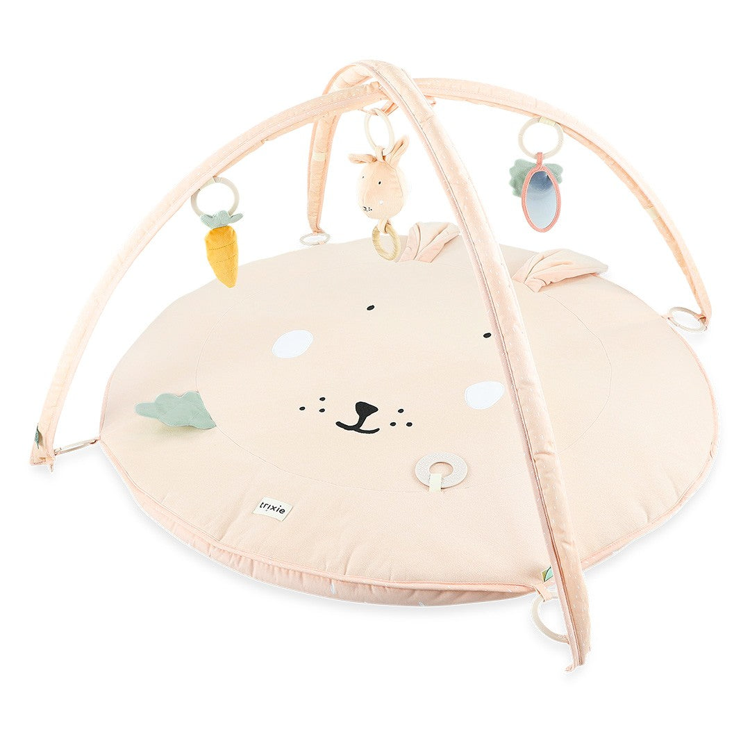 Trixie Baby Mrs. Rabbit activity play mat with arches and hanging sensory toys from above