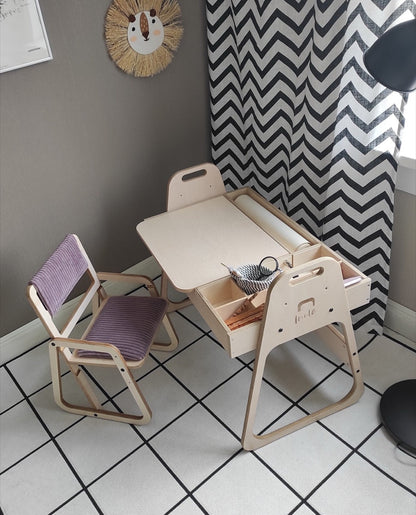 Cannon pink Montessori table and chair set in playroom with gray and white decor