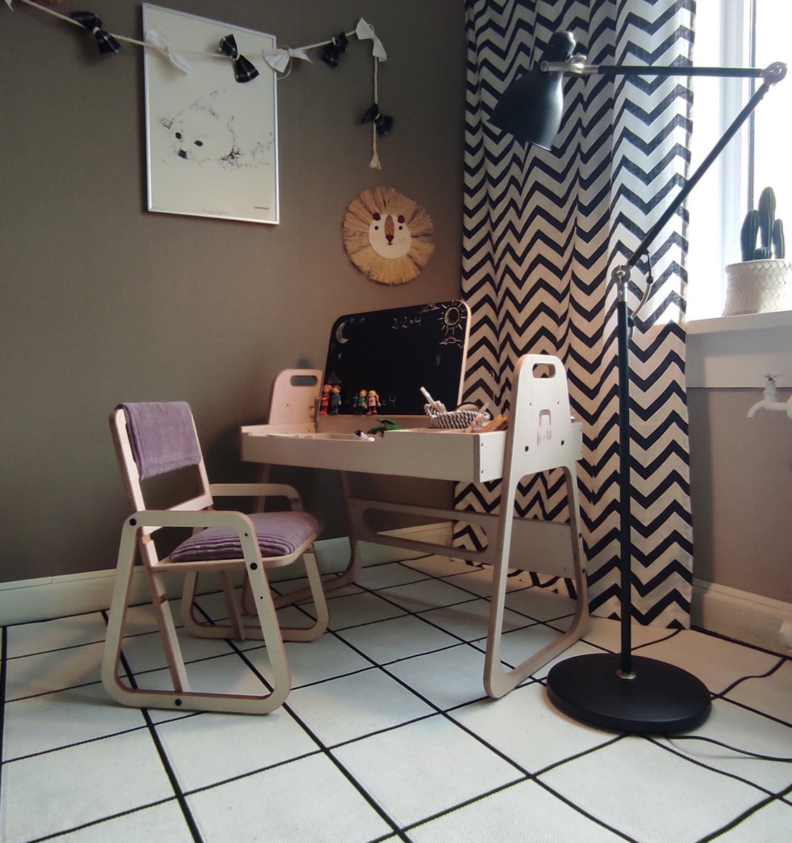 Cannon pink Montessori table and chair set in modern bedroom with chalkboard and paper roll