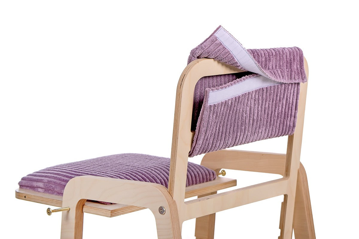 Close-up detail of cannon pink fabric seat and backrest on Montessori chair