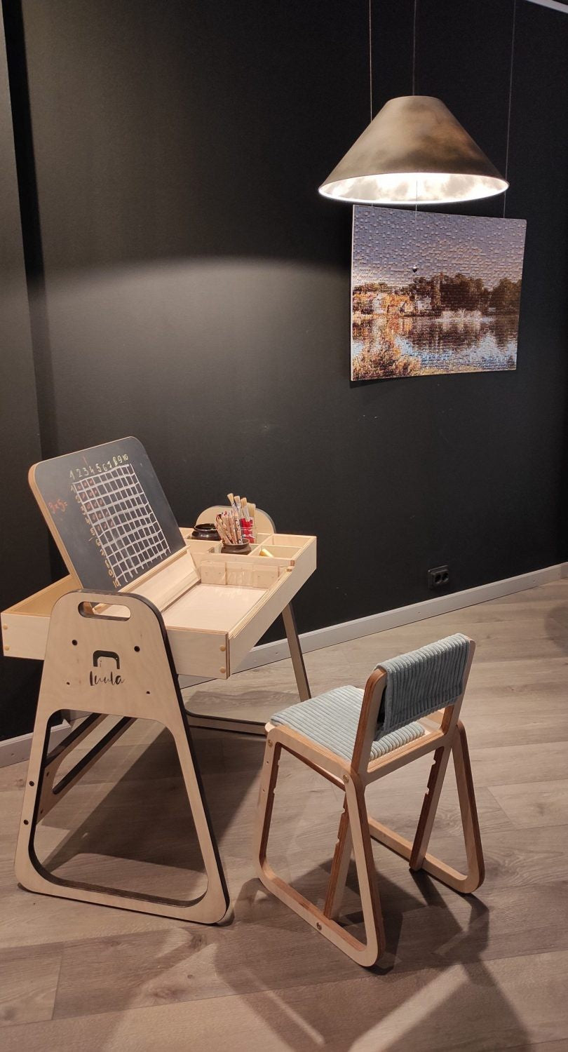 Pendant lamp illuminating child's workspace at Luula Julle Montessori table and chair