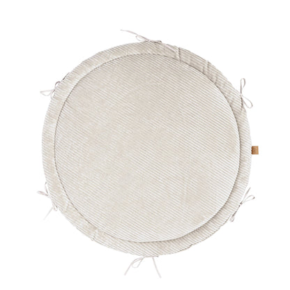 Ecru braided baby nest mat viewed from above showing ribbed corduroy border and play surface