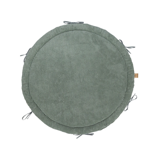 Olive green baby nest play mat with braided crib bumper border, top view