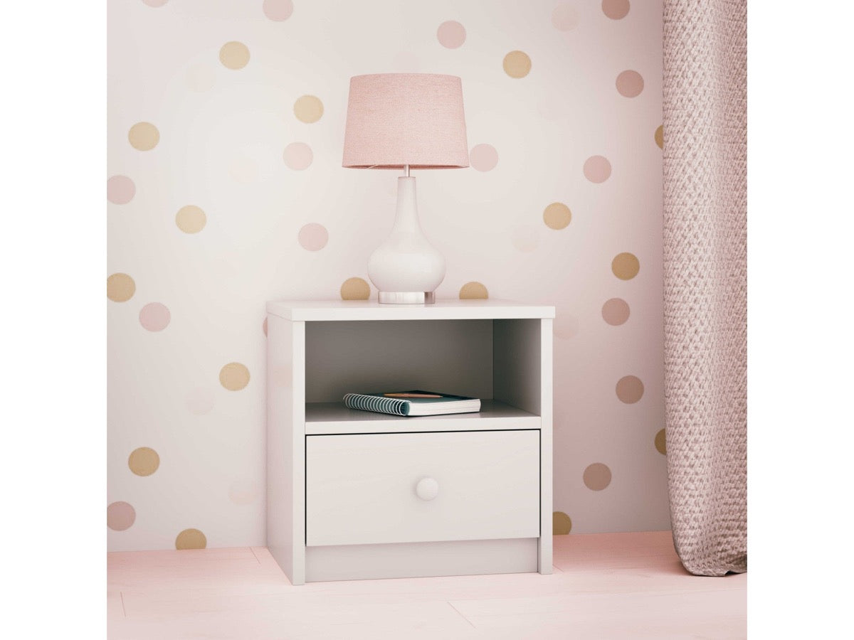 White Babydreams nightstand styled with lamp and books in bedroom