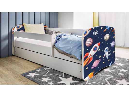 White children's bed with cosmos print headboard and guardrail, storage drawer, and birch slat frame in bedroom setting
