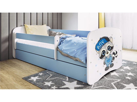 Kocot Kids Babydreams children's bed with raccoon design in bedroom setting, blue drawer and white guardrail