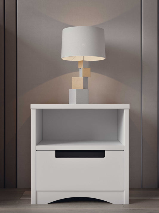 White kids bedside table with lamp and modern design in bedroom setting