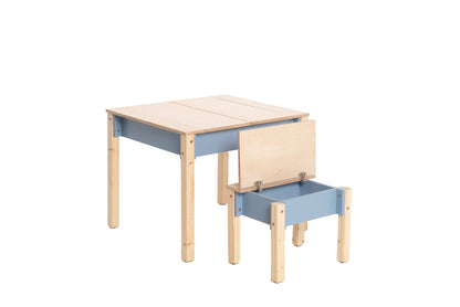 Child reading at natural wood table with storage drawer and hinged top