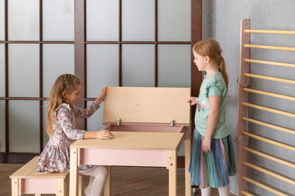 Child at table with storage drawer in teal, featuring natural wood frame