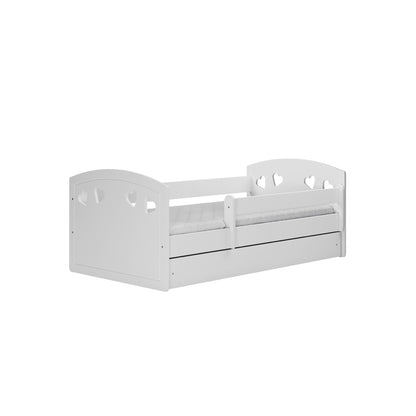 White Julia children's bed with heart cutouts, angled view showing trundle drawer