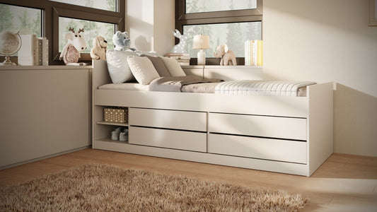 White Leon children's bed with four storage drawers in bright bedroom with pillows and rug
