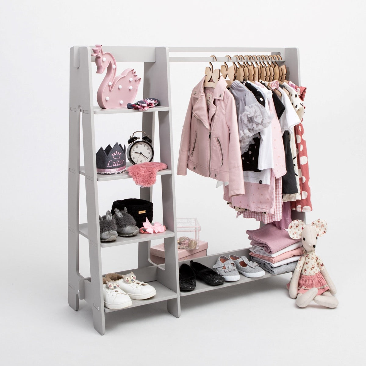 Grey Montessori kids clothing rack with multiple shelves, hanging rod, and shoes