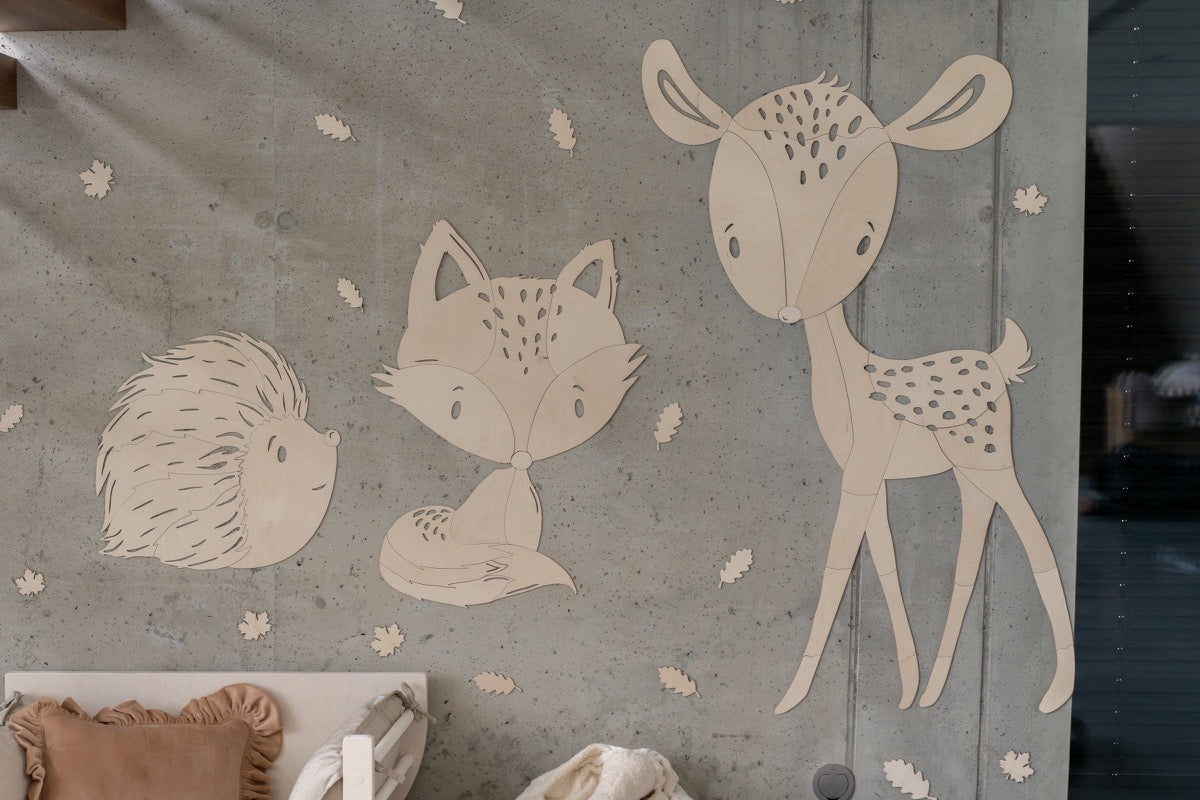 Collection of forest animals wooden wall decorations including deer, fox, and hedgehog