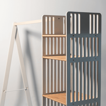 Charcoal gray and natural wood kids clothing rack displaying open shelf storage with vertical slatted panels